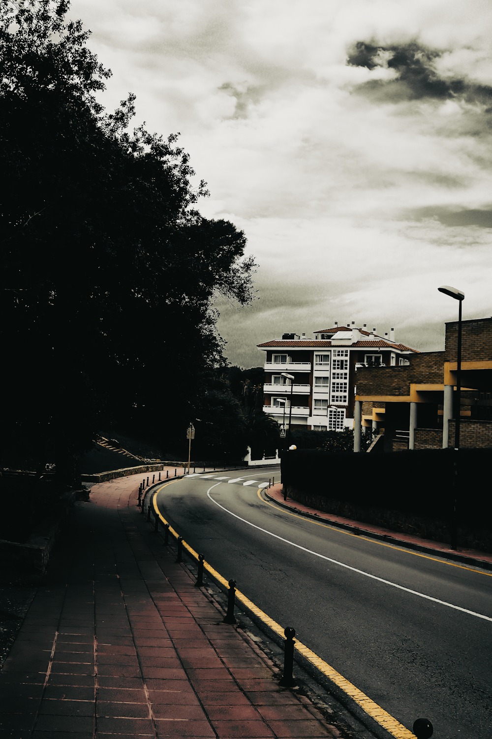 a road with a building in the background