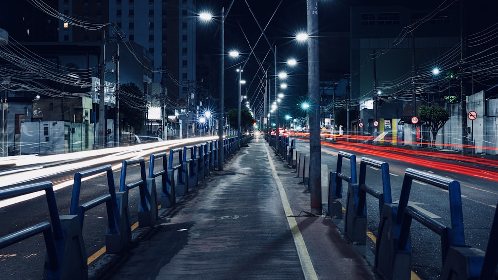 a city street at night with street lights