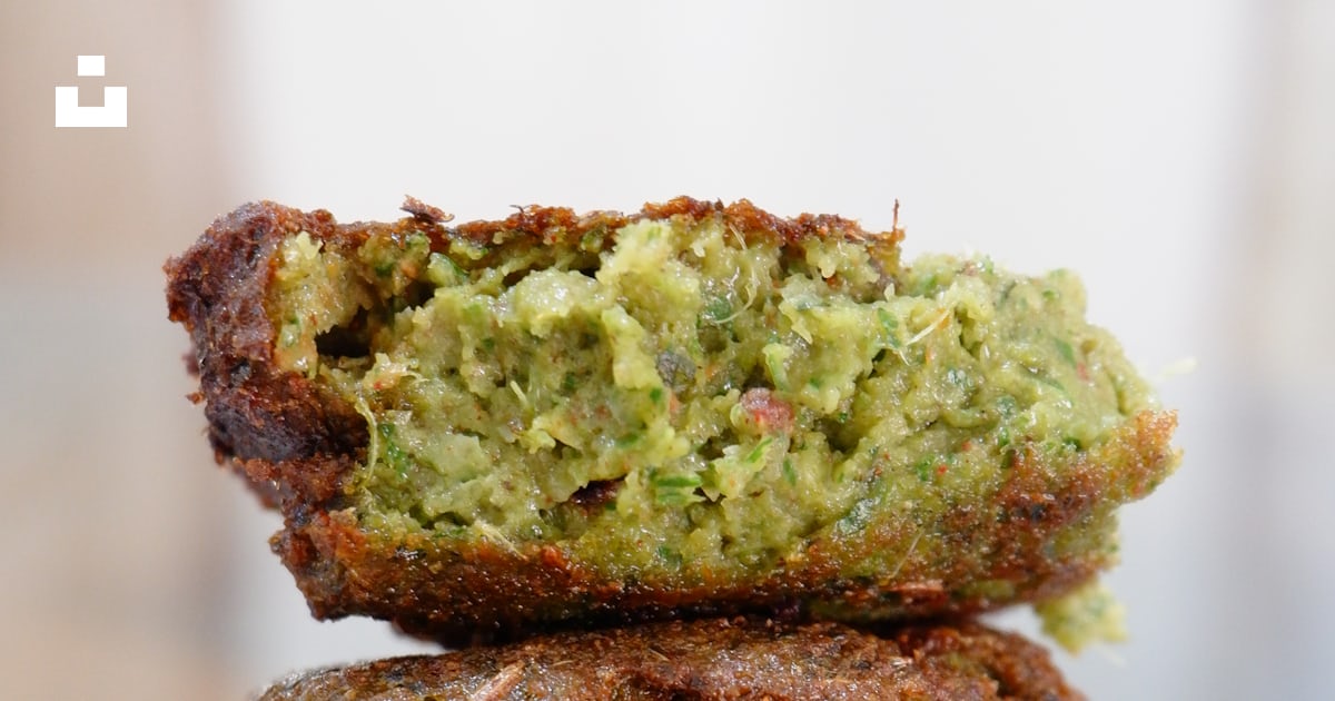 A stack of food sitting on top of a metal rack photo – Free Falafel ...