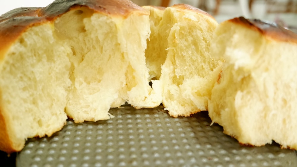 a close up of a piece of bread with a bite taken out of it