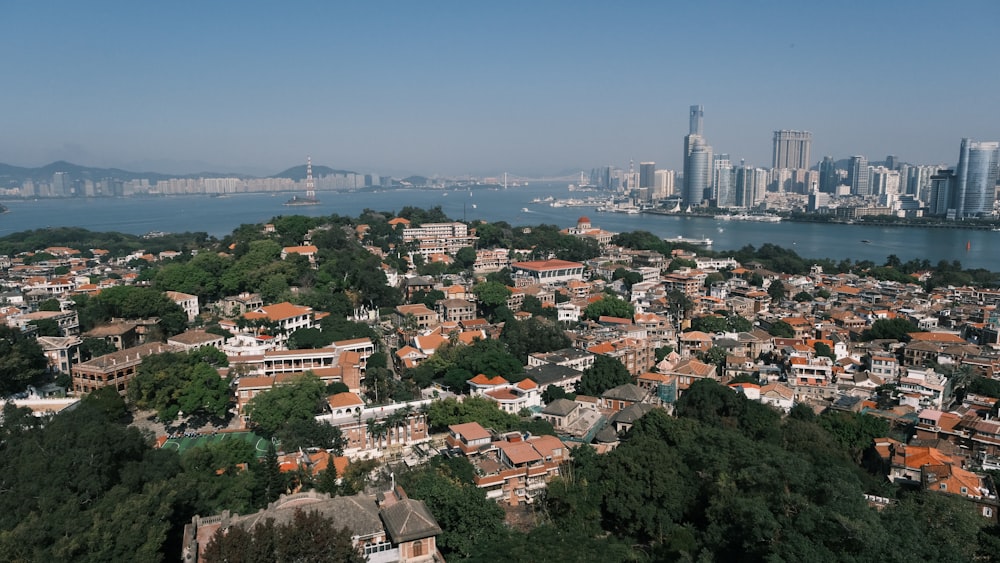 an aerial view of a city and a body of water