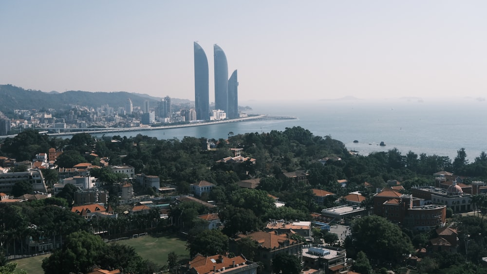 an aerial view of a city and a body of water