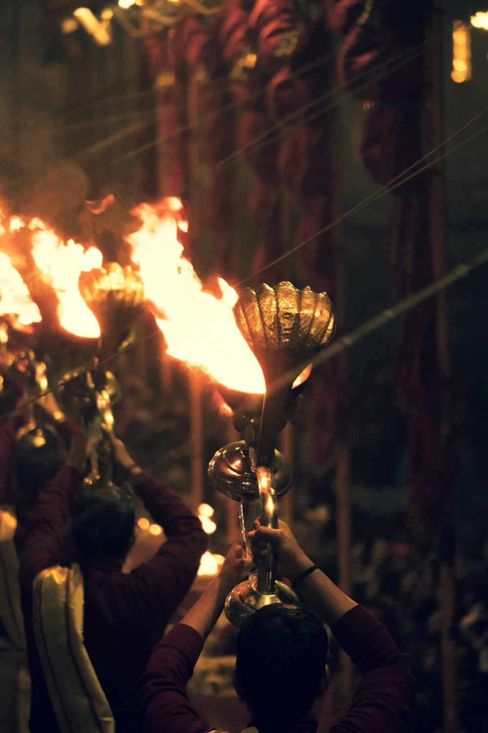 a group of people holding torches in their hands