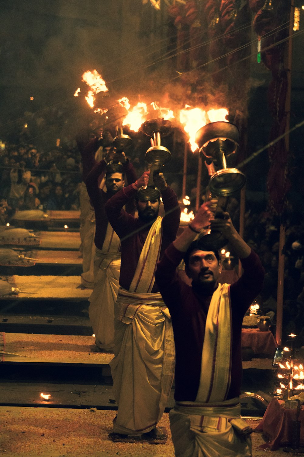 a group of men holding torches in their hands