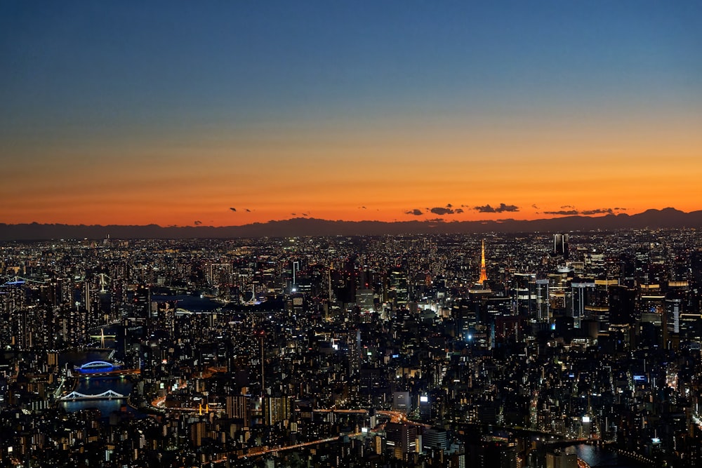 a view of a city at night from the top of a building