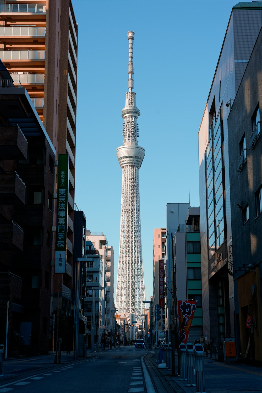 a tall white tower towering over a city