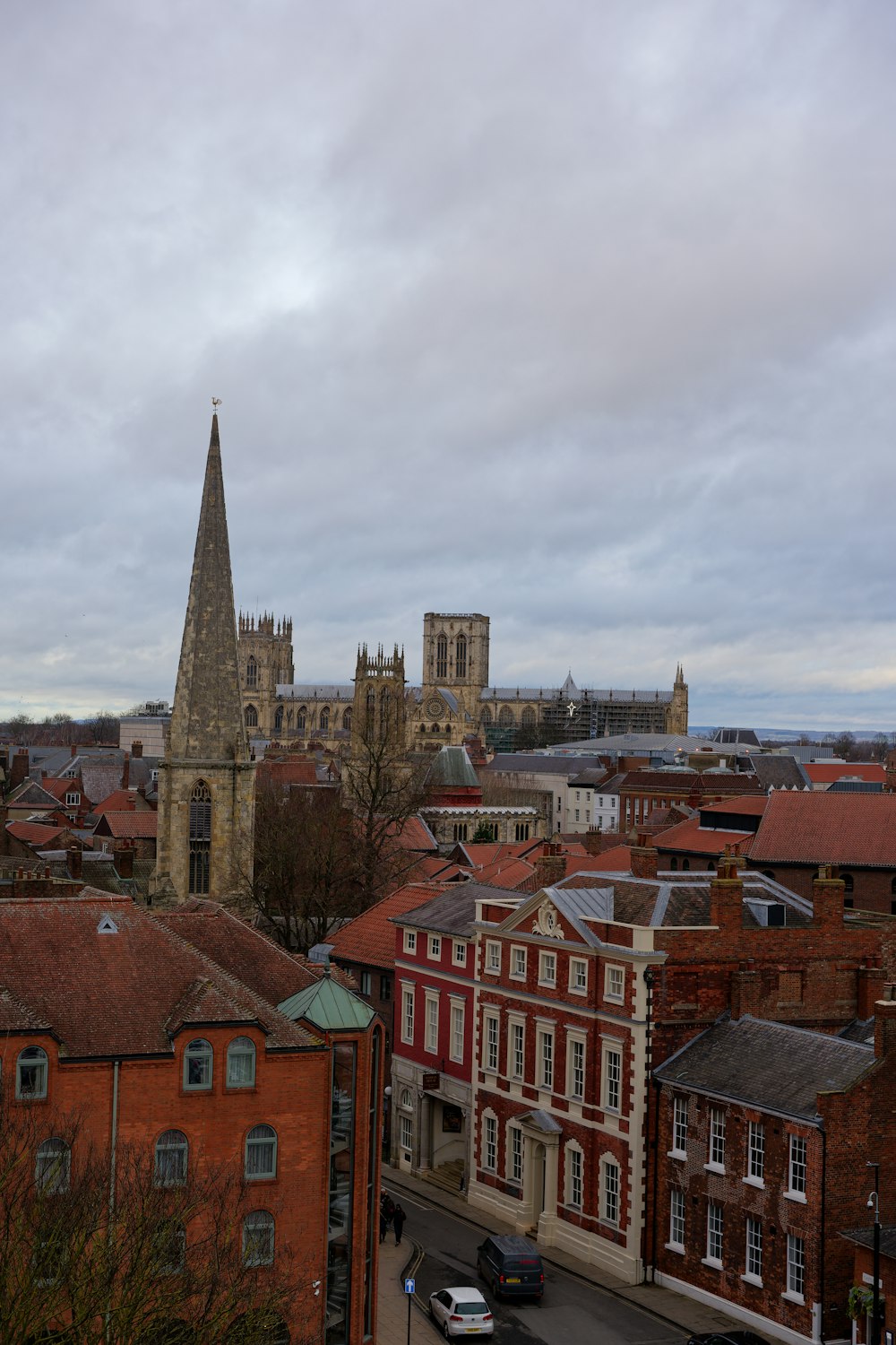 a view of a city with a church steeple in the background