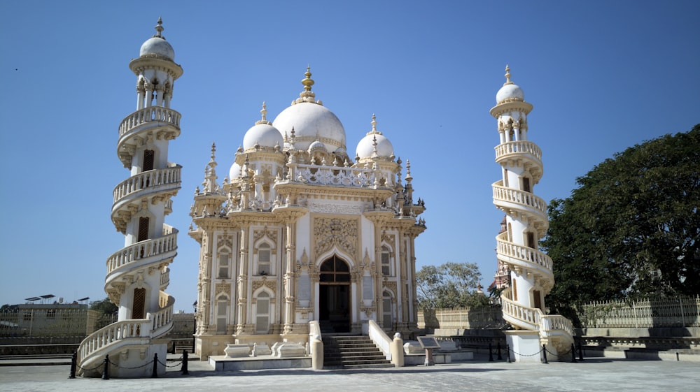 a large white building with a staircase leading up to it