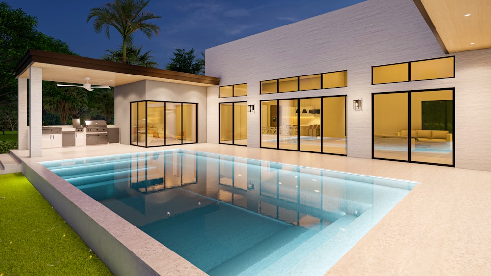 a modern house with a swimming pool at night