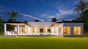 a modern house with a pool in front of it