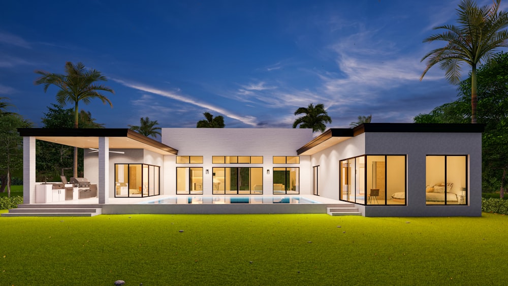 a modern house with a pool in front of it