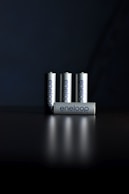 a group of four batteries sitting on top of a table