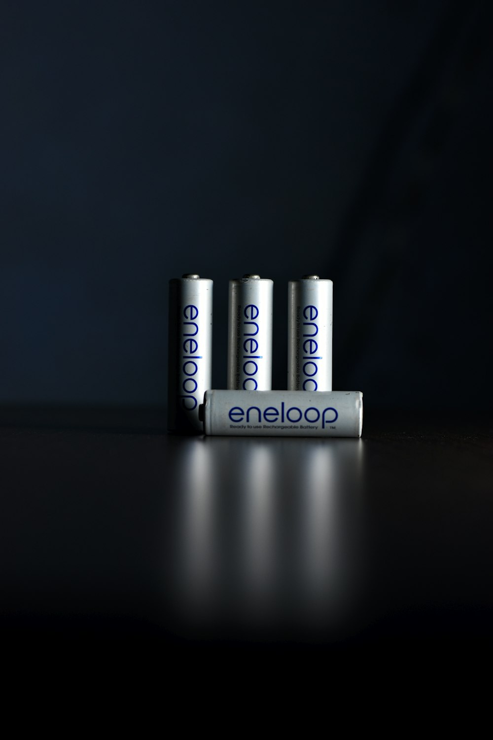 a group of four batteries sitting on top of a table