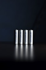 a group of three batteries sitting on top of a table