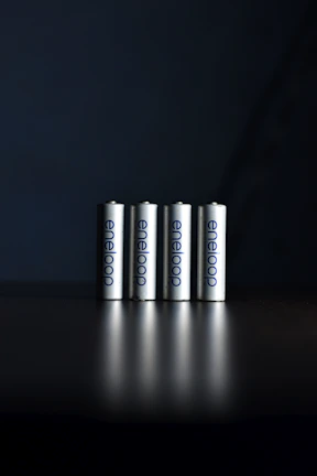 a group of three batteries sitting on top of a table