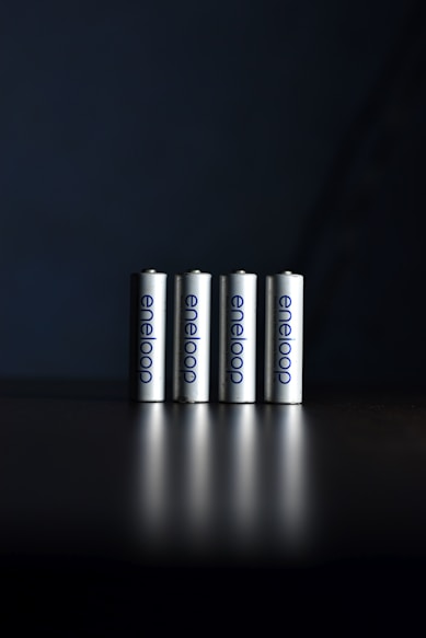 a group of three batteries sitting on top of a table