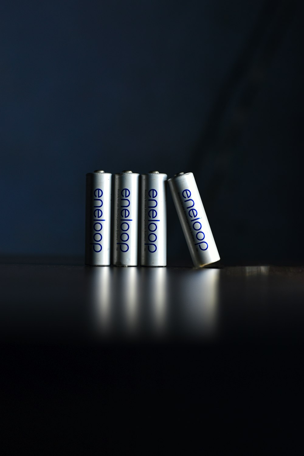 a group of four batteries sitting on top of a table
