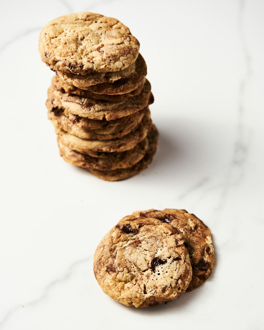 a stack of cookies sitting on top of a white counter