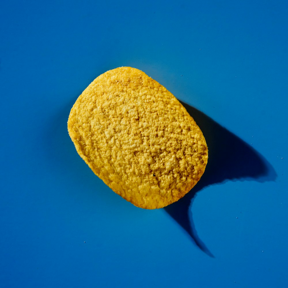 a yellow sponge on a blue background