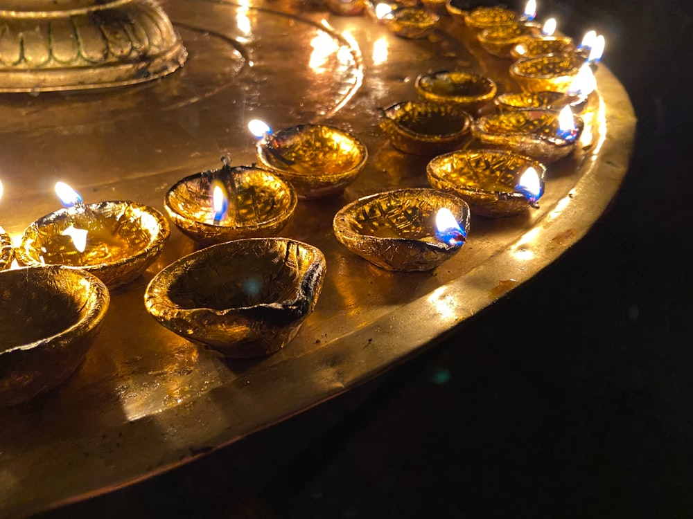 a bunch of candles that are on a table