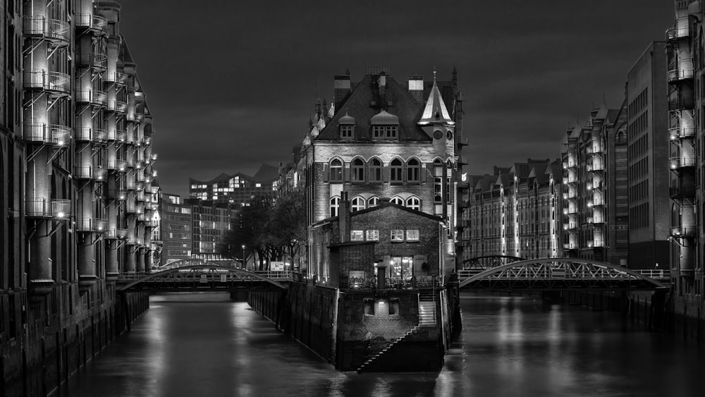 a black and white photo of a city at night