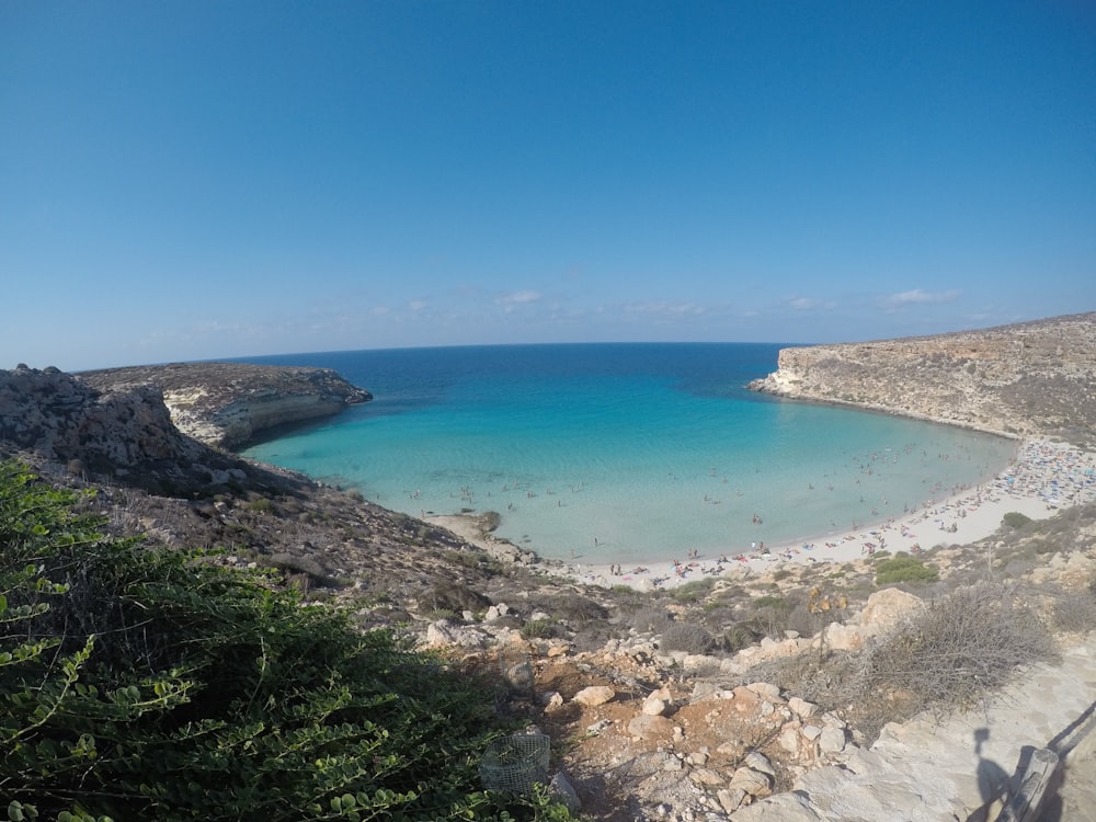 a view of a beach with clear blue water