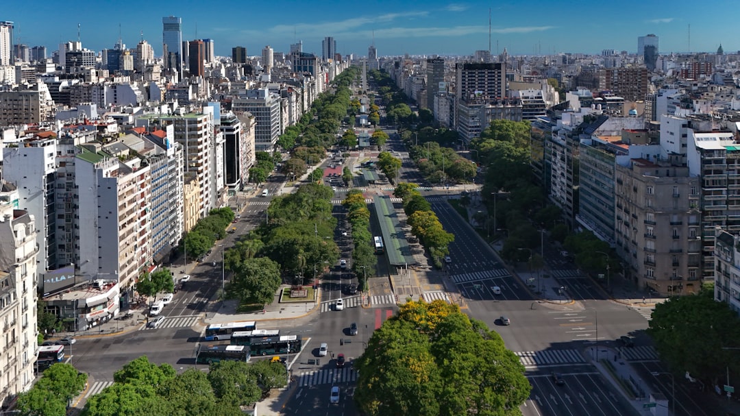 an aerial view of a city with tall buildings,