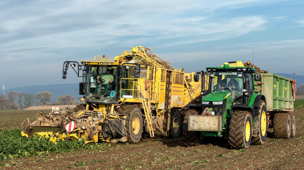 a tractor and a tractor trailer in a field