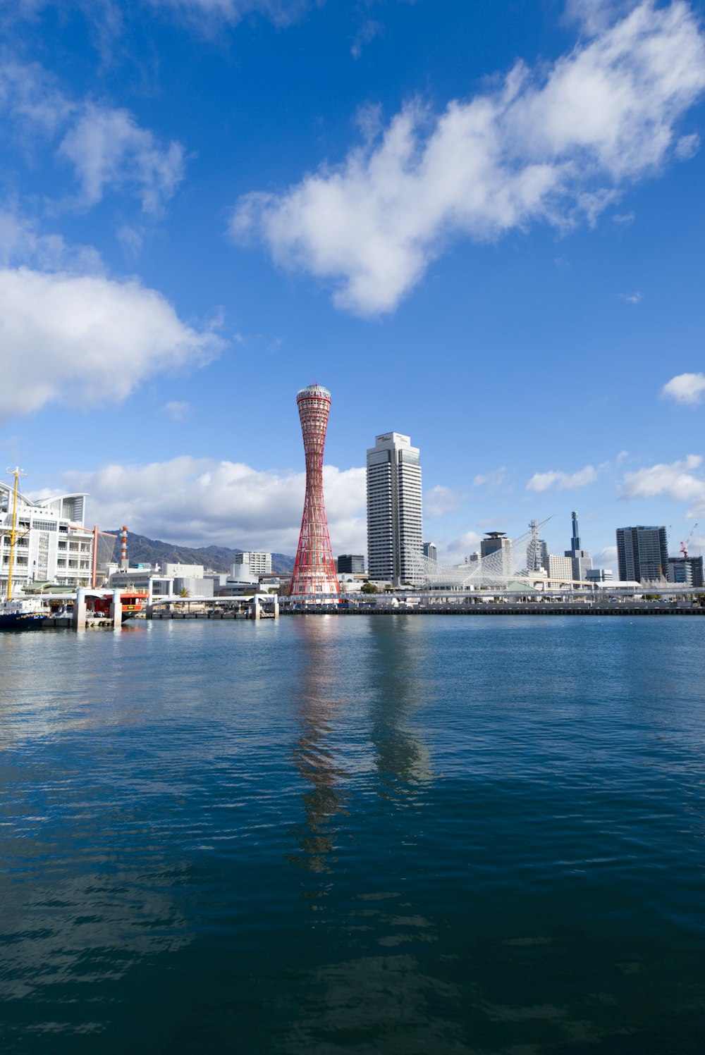 a body of water with buildings in the background