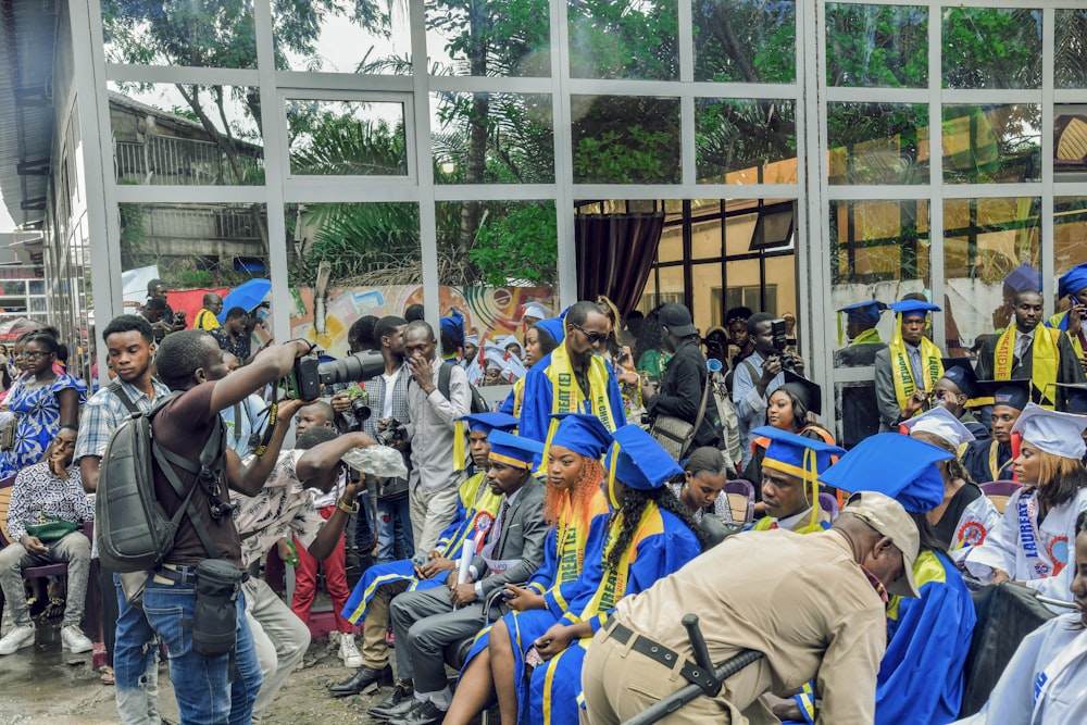 a group of people in graduation caps and gowns