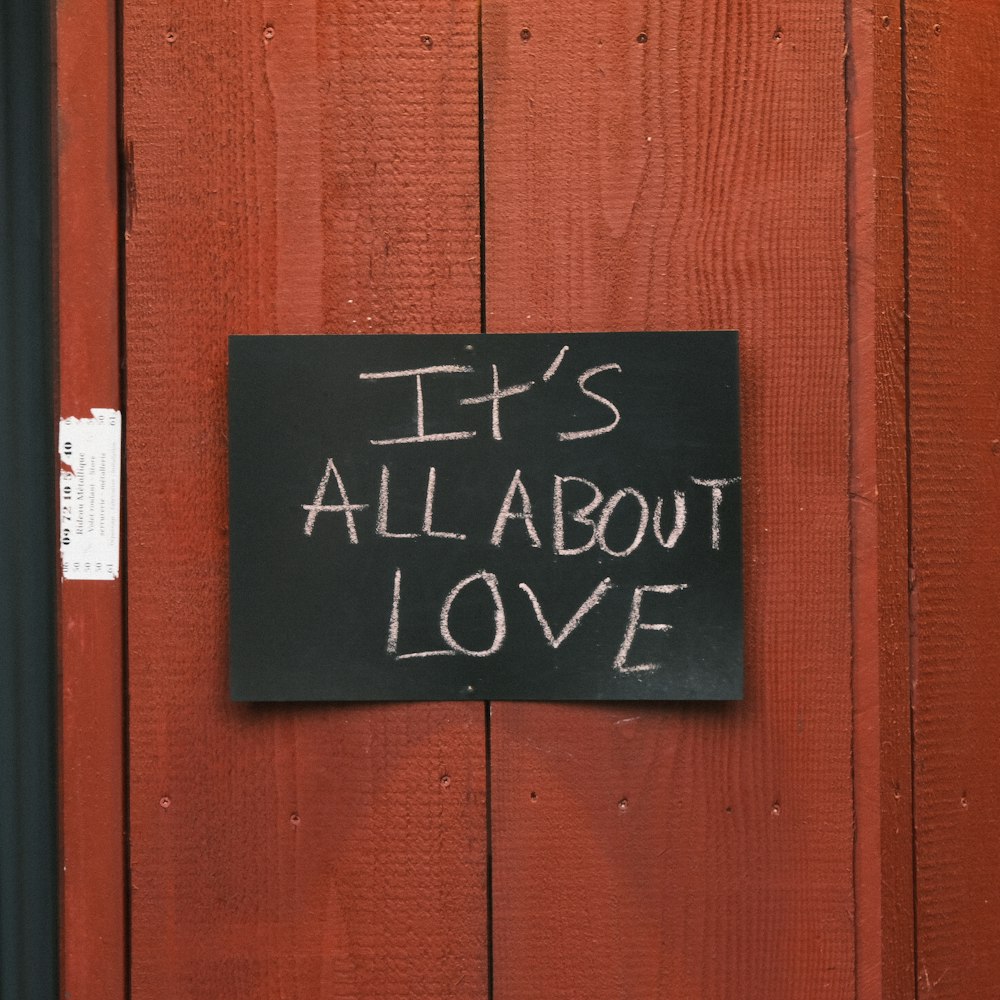 a sign on a door that says it's all about love