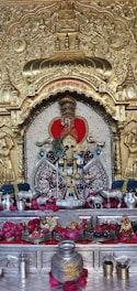 a shrine with a gold and red decoration