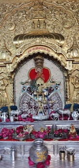 a shrine with a gold and red decoration