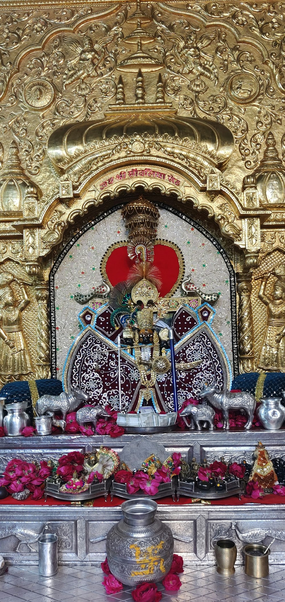 a shrine with a gold and red decoration