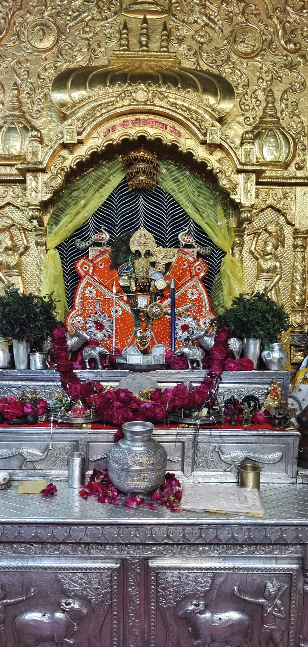 a shrine with a statue of a hindu god