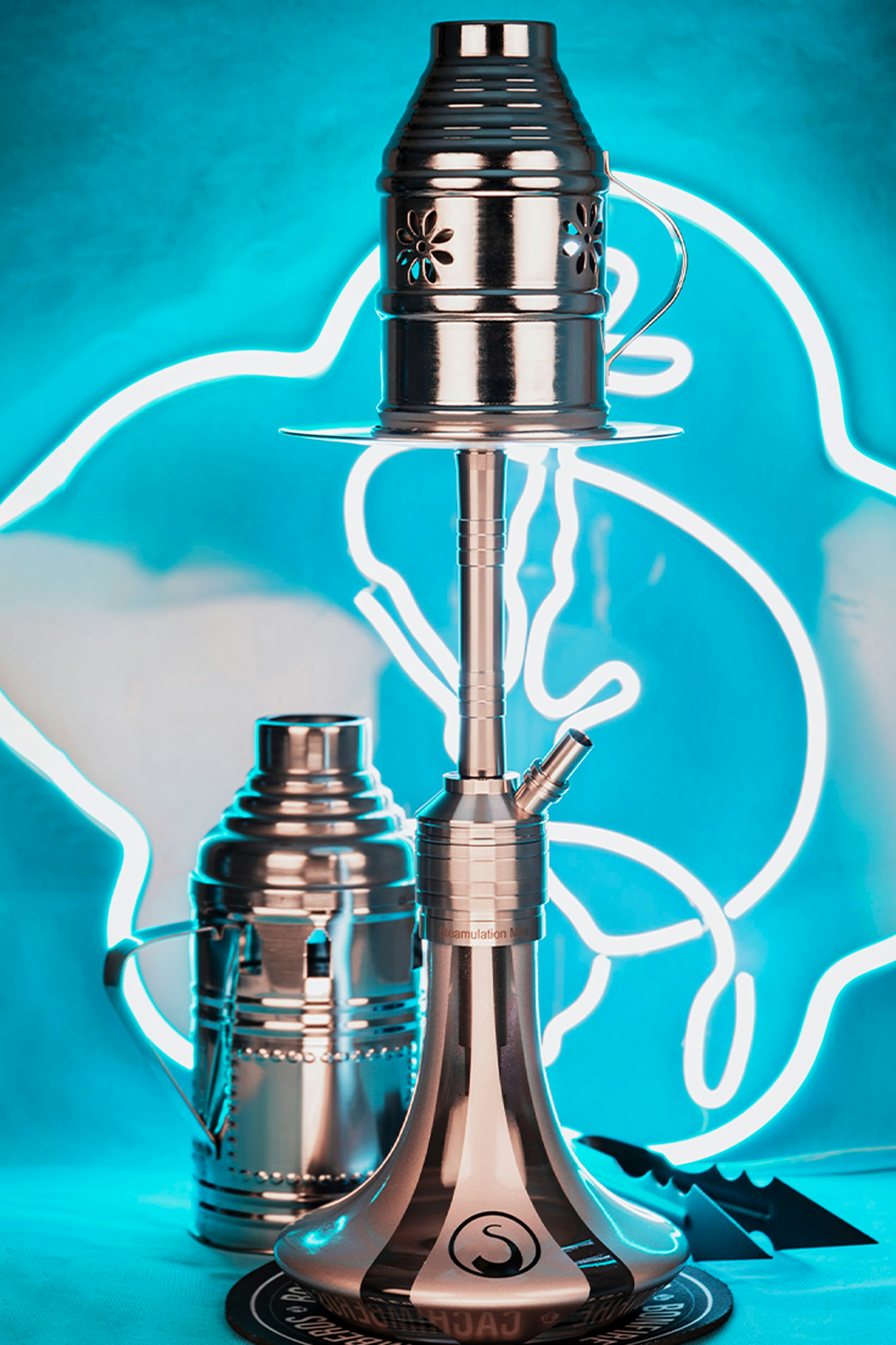 A silver lamp sitting on top of a table