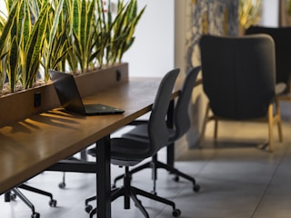a long table with a laptop on top of it