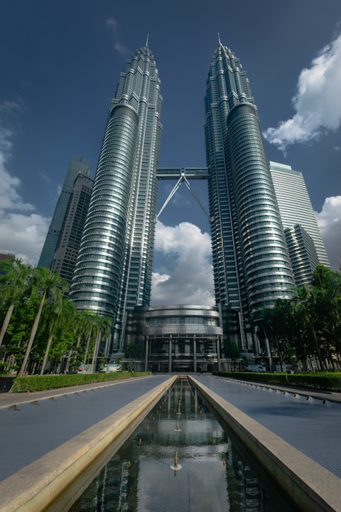 a couple of tall buildings sitting next to each other