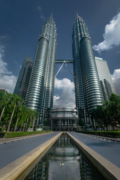 a couple of tall buildings sitting next to each other