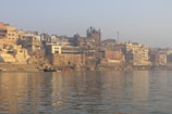 a body of water with a city in the background