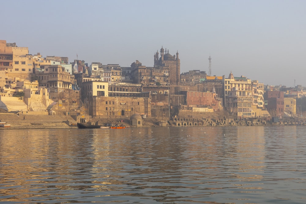 a body of water with a city in the background