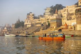 a group of boats floating on top of a river