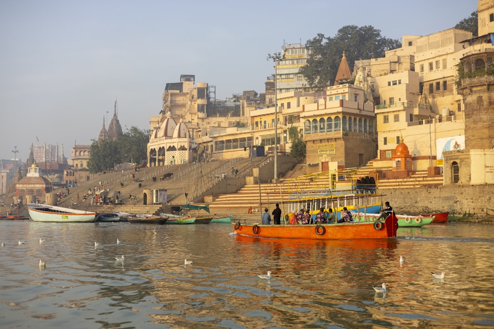 a group of boats floating on top of a river