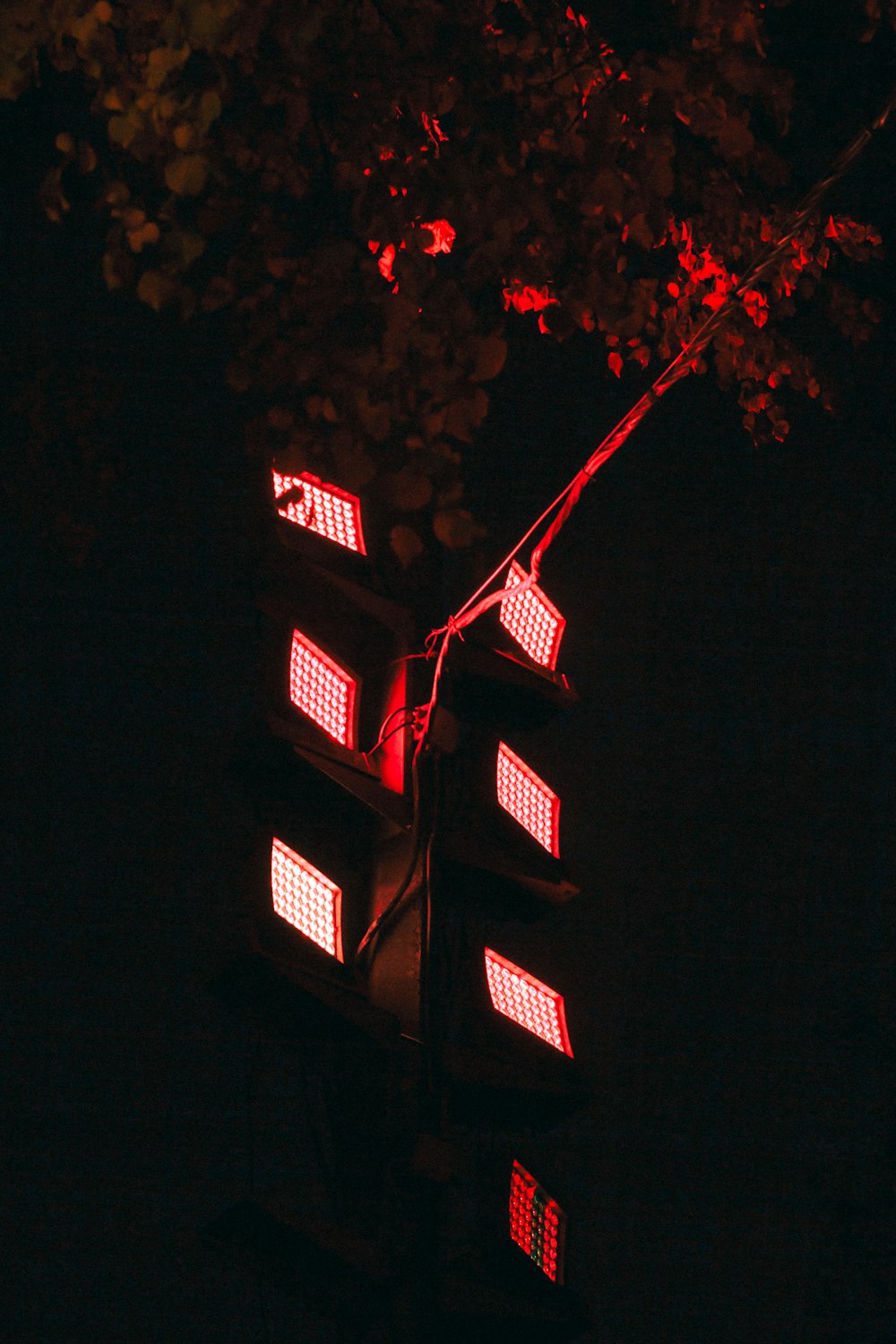 a traffic light is lit up in the dark
