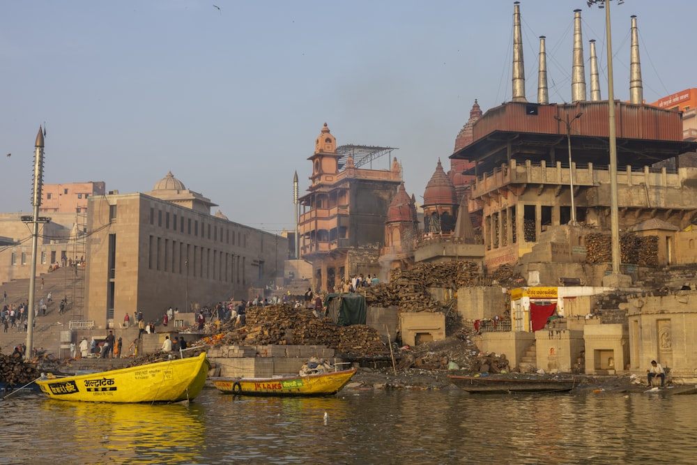 a yellow boat floating on top of a body of water