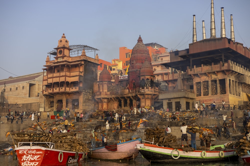 a group of boats floating on top of a body of water