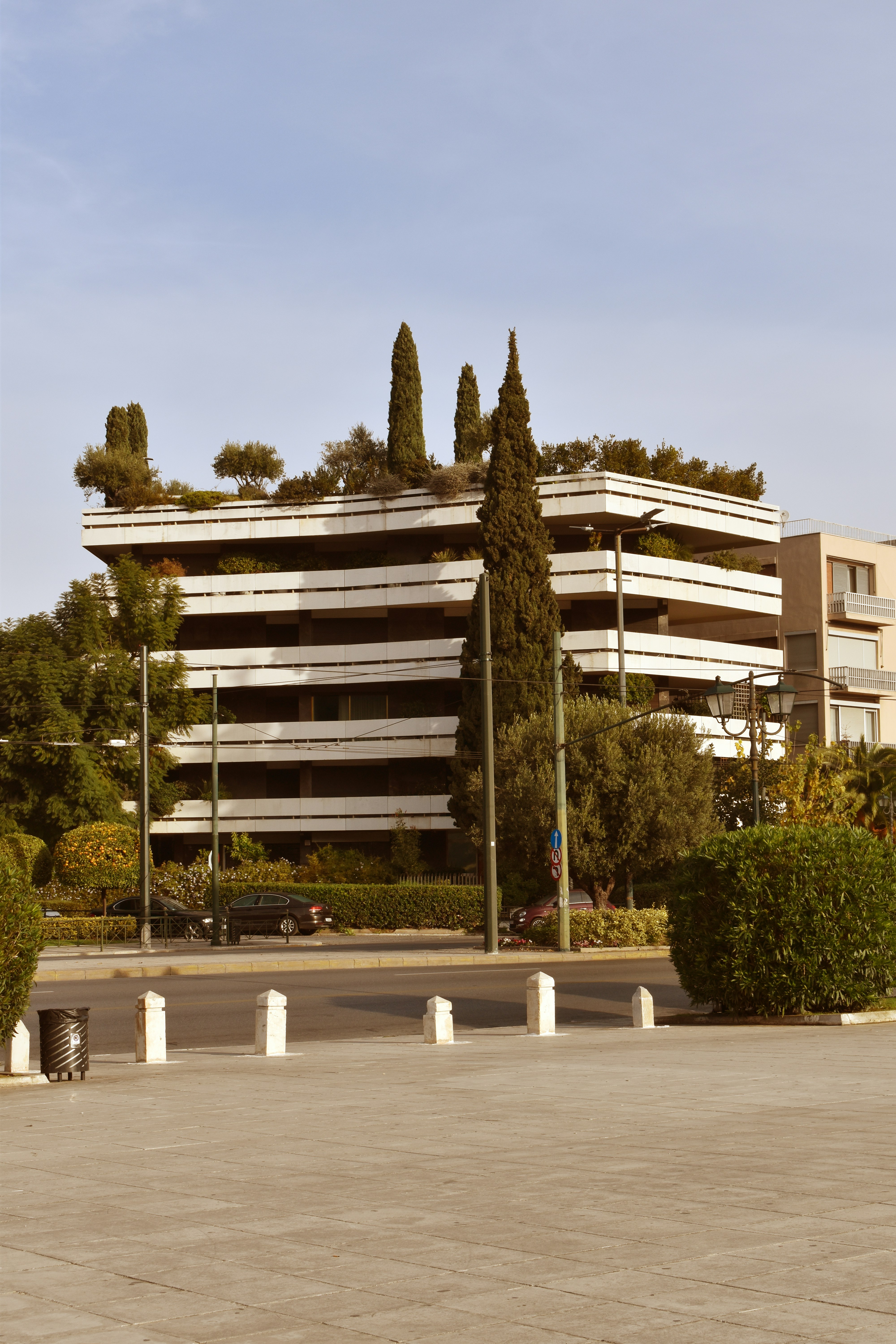 a parking lot with a building in the background