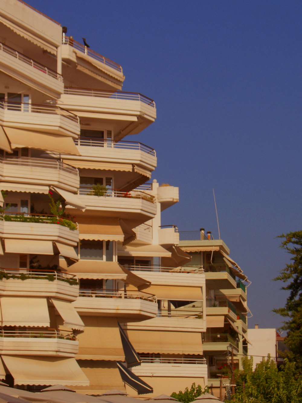 a tall building with balconies and balconies on top of it