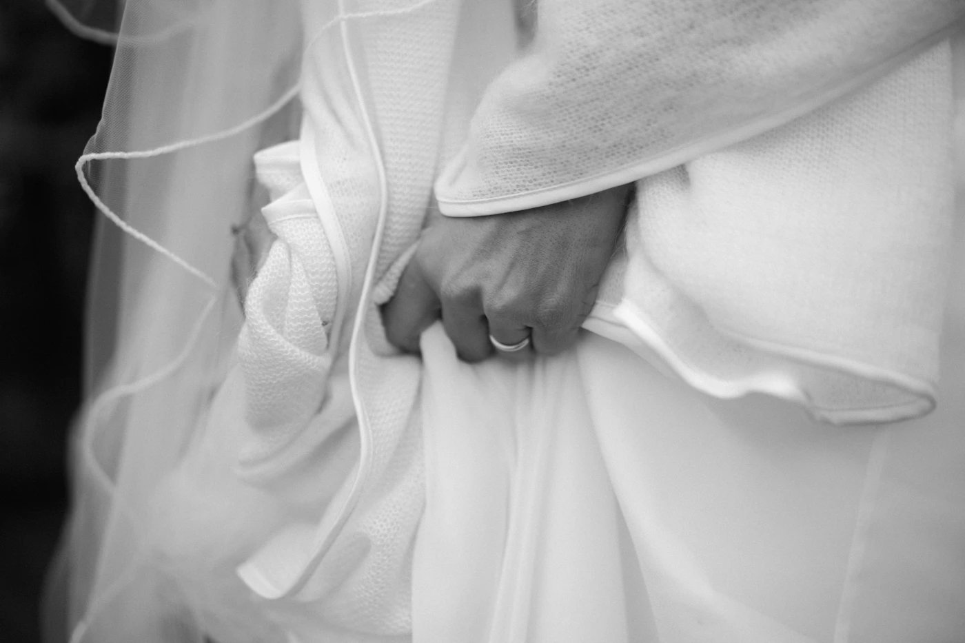 Alteration tips for off-the-rack wedding dresses — A close-up of a bustling mechanism on the train of a formal wedding dress.