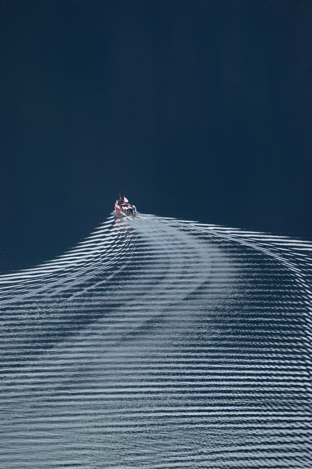 a group of people riding skis on top of a snow covered slope